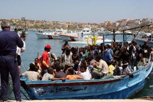 Would-be immigrants arrive on a boat in