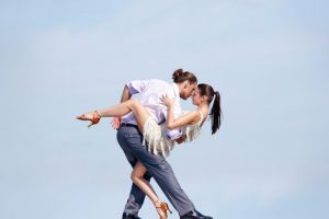 Image of beautiful couple dancing outside