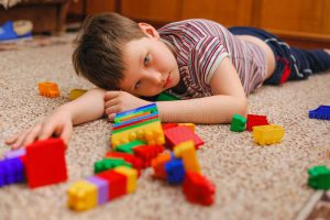sad-kid-near-fallen-tower-constructor-sad-kid-near-broken-tower-constructor-168892887