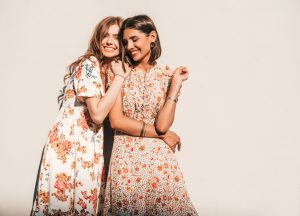 two-young-beautiful-smiling-hipster-girls-trendy-summer-sundresses-1