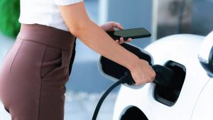 1_Closeup-progressive-woman-recharge-her-EV-car-at-home-charging-station
