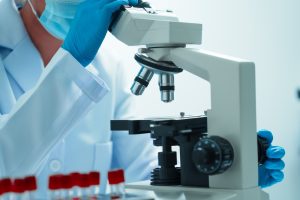 Close,Up,Dedicated,Hematology,Lab,Technician,Scrutinizing,Blood,Sample,Analysis